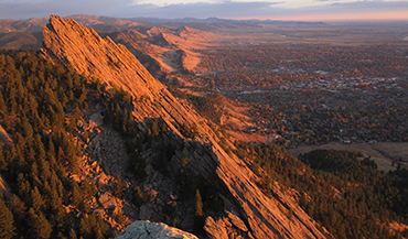 View from the Third Flatiron just after sunrise, with Boulder, Colorado, in the distance. (Credit: David Stillman, 2010. Creative Commons license CC BY-NC 2.0)